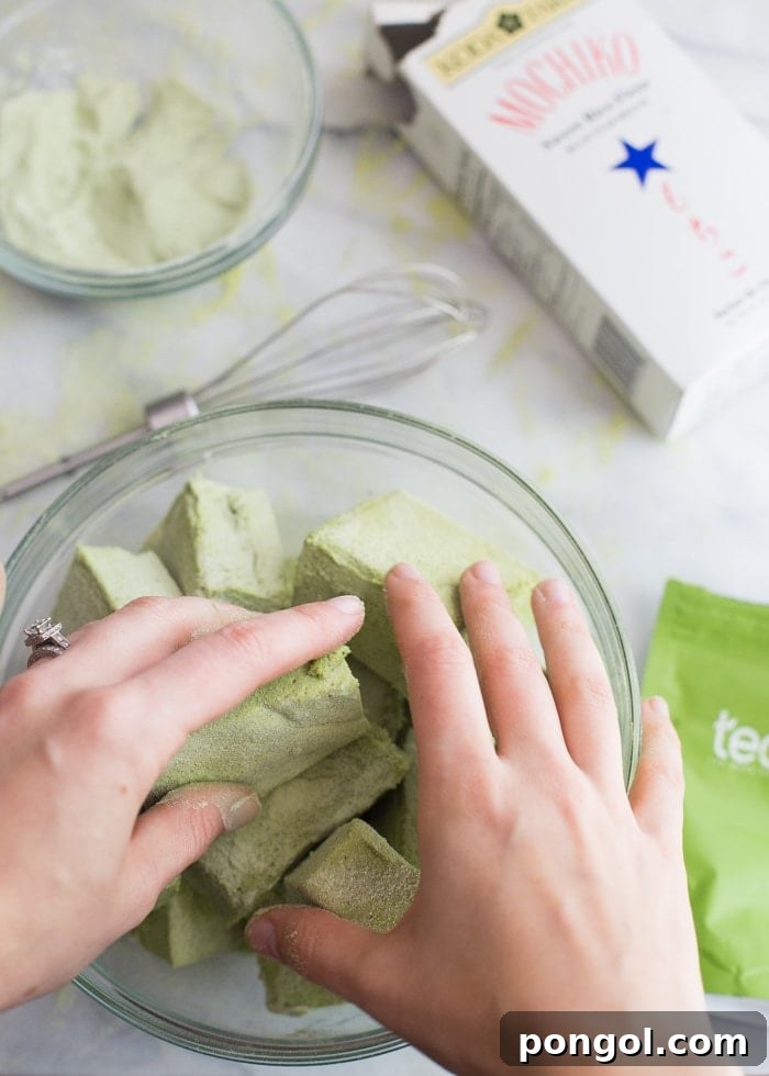 A stack of homemade Matcha Marshmallows, highlighting their unique green hue.