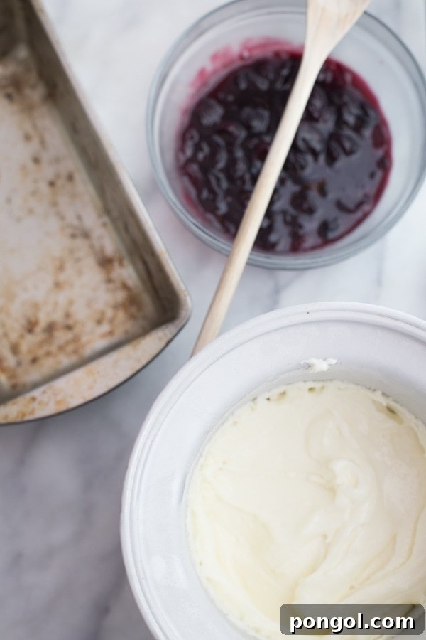 Ingredients for Jeni's goat cheese and roasted cherry ice cream laid out on a table.