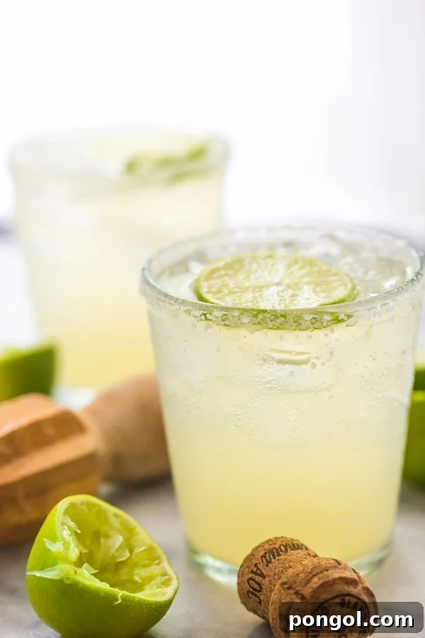 A pristine bottle of Patron Reposado tequila, the key ingredient for an exceptional margarita.