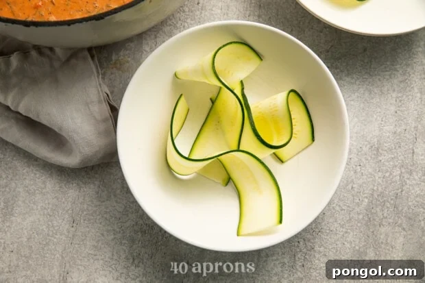 Thin slices of zucchini ready in a bowl for the soup