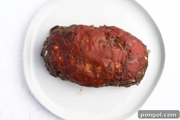 Glazed meatloaf on white plate