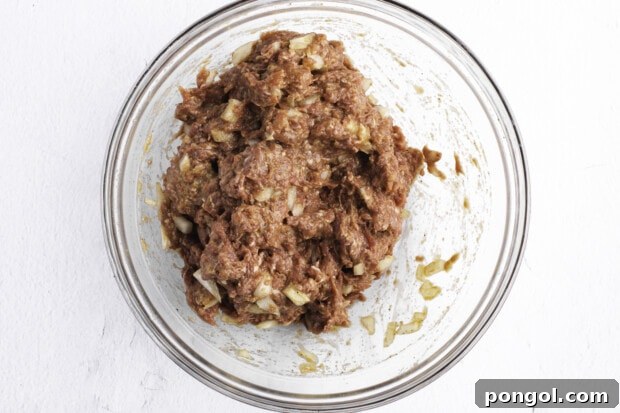 Ground beef and onion mixture in large bowl