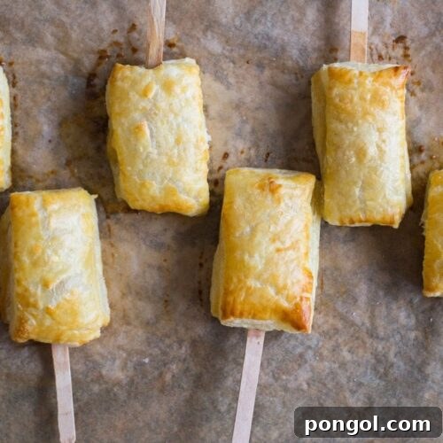 Baked brie bites with apricot jam. Flaky, crispy puff pastry, rich, melty brie, perfectly sweet apricot jam. An ideal holiday appetizer for entertaining.