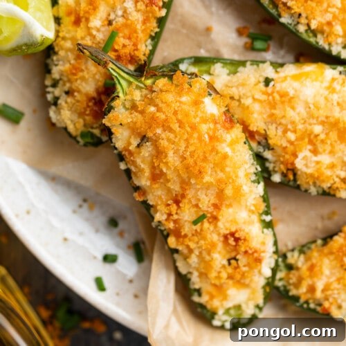 close-up overhead image of air fryer jalapeno poppers on a plate