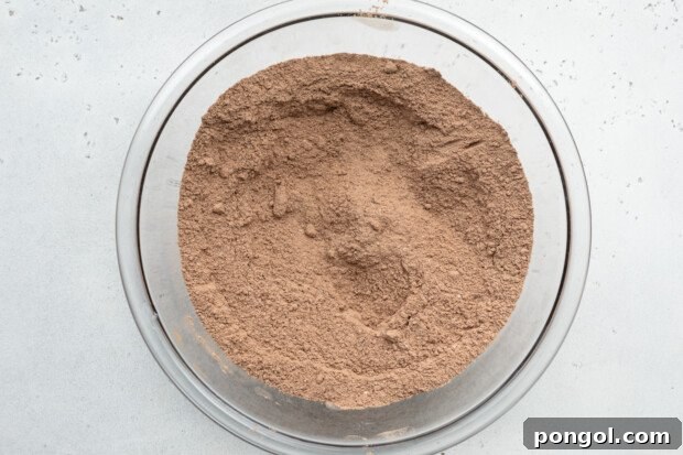 Overhead view of dry ingredients for chocolate gluten-free donuts.