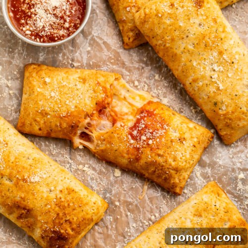Air Fryer Hot Pockets From Freezer to Fresh 4 Overhead view of air fryer hot pockets (frozen and homemade) on parchment paper with pizza sauce.