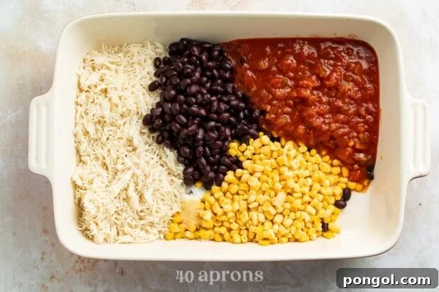 Ingredients for Mexican chicken casserole in rectangular white casserole dish.