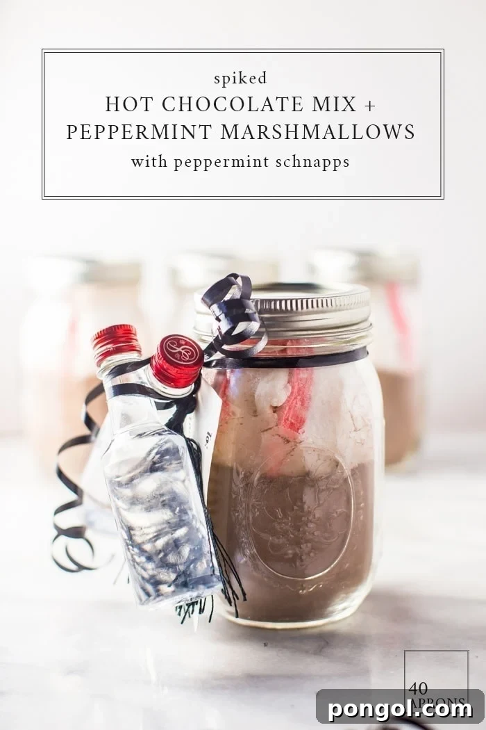 This spiked peppermint hot chocolate gift kit is a perfect easy, cheap gift idea for Christmas. Ideal for teachers, childcare providers, coworkers, family, and friends, they'll love the creamy hot chocolate mix, homemade peppermint marshmallows, and peppermint schnapps for that extra kick!