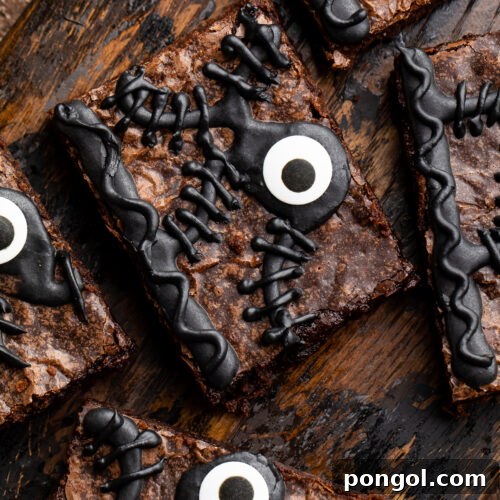 Close-up of one Hocus Pocus spellbook brownie out of 5 on a wooden tray surrounded by Halloween imagery.