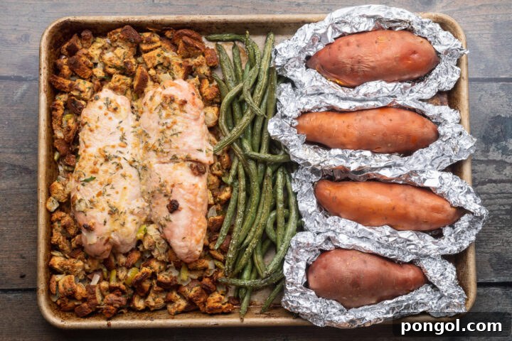 Effortless Holiday Feast 12 Fully prepared one-pan holiday meal on a baking sheet