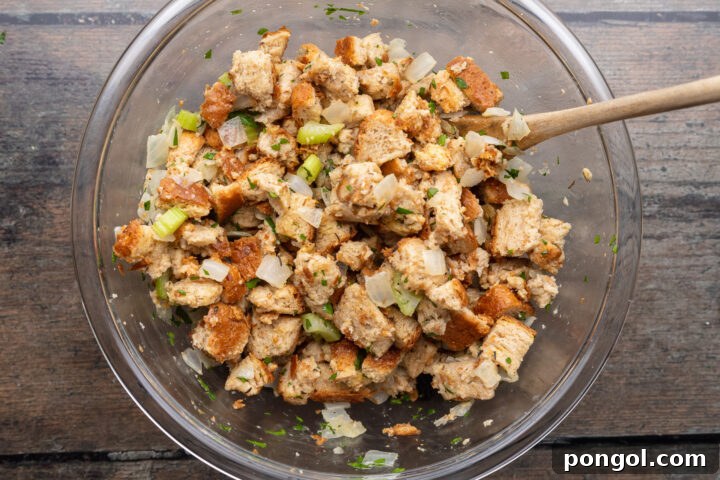 Effortless Holiday Feast 7 Stuffing mixture in a glass mixing bowl