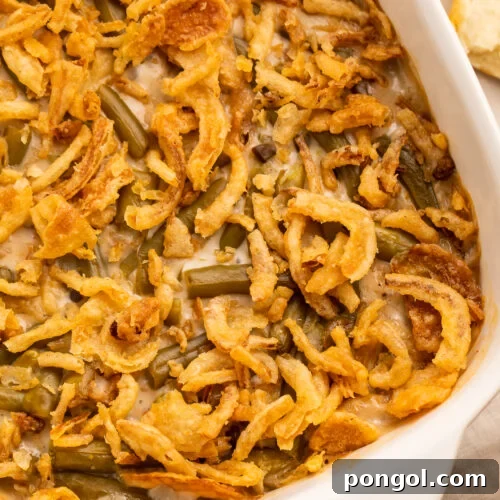 Make Ahead Green Bean Bake 4 Close up, overhead view of an angled casserole dish holding a make ahead green bean casserole.