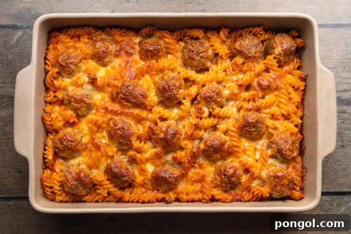 Overhead view of meatball casserole topped with mozzarella.