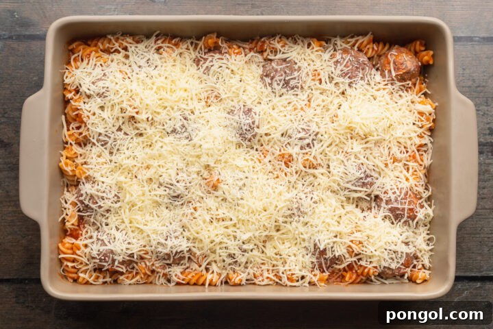 Overhead view of meatball casserole topped with mozzarella.