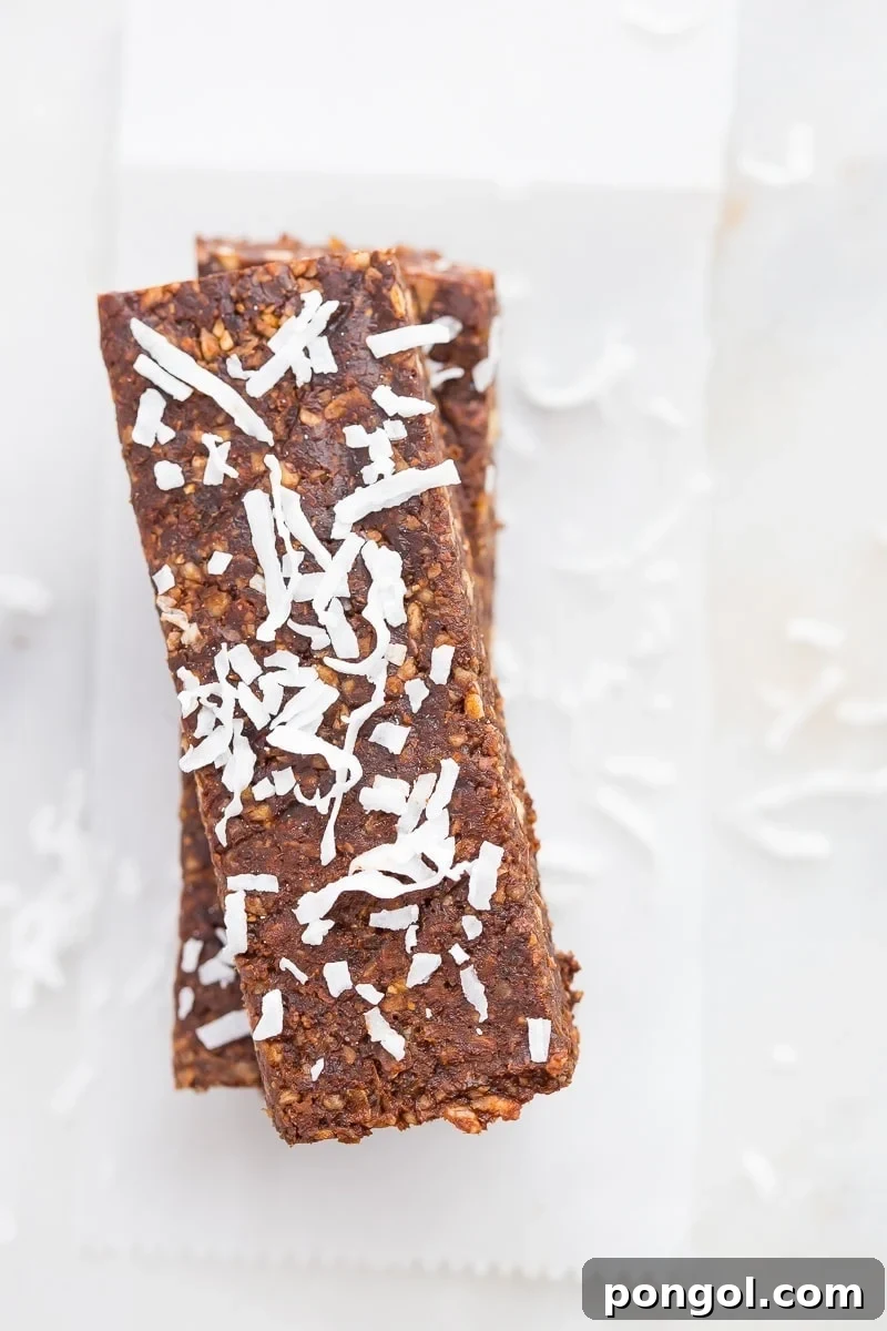 Paleo Vegan Almond Joy Bars 4 Close-up of Paleo Almond Joy Lara Bars, showing the texture and delicious combination of coconut and chocolate.