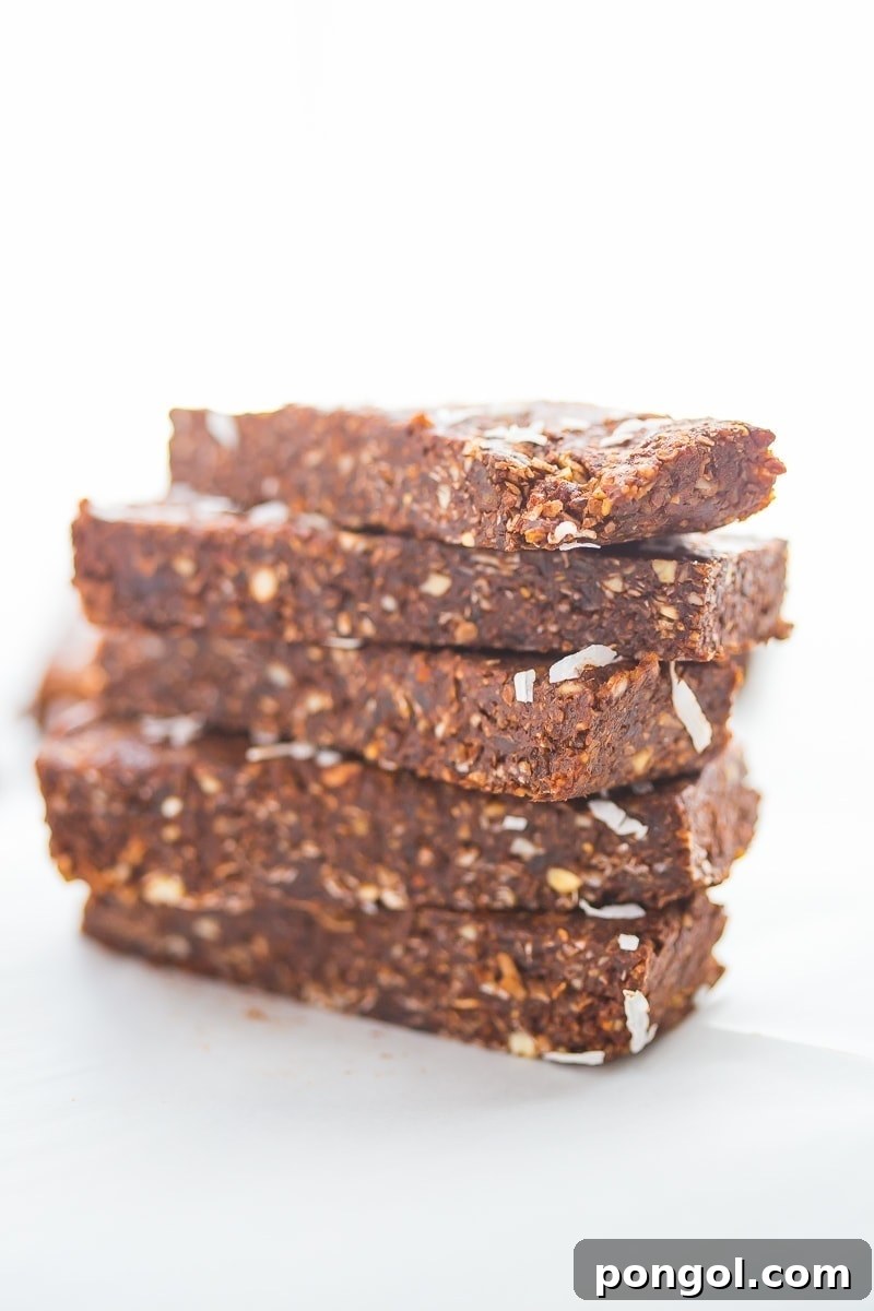 Paleo Vegan Almond Joy Bars 5 Stack of freshly made Paleo Almond Joy Lara Bars, ready for a healthy snack or meal prep.