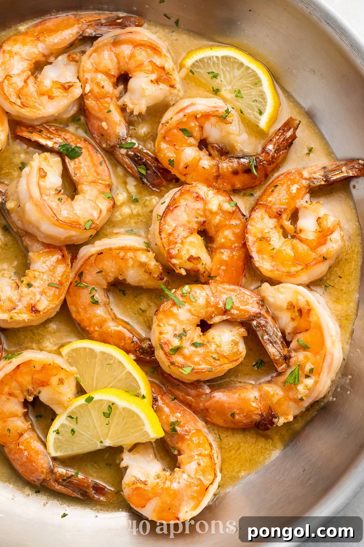 Garlic Butter Shrimp Sauté 2 Sautéed garlic butter shrimp in a large silver skillet, ready to be served.