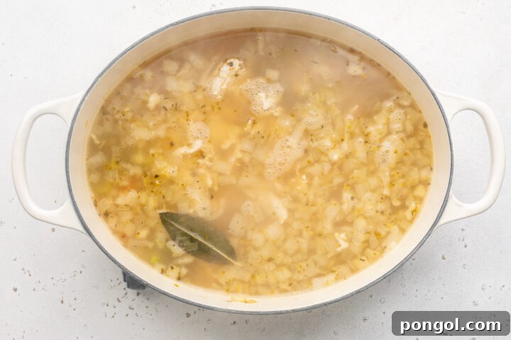 Keto chicken noodle soup in a large oval soup pot.
