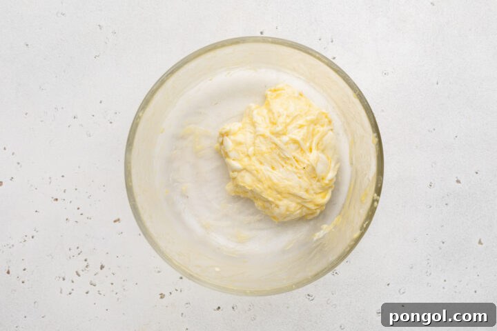 Ball of keto noodle dough in a small white bowl.