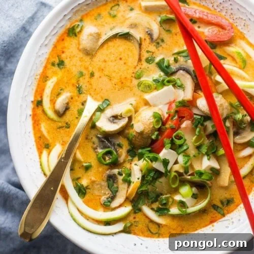 This paleo coconut curry zoodle soup is quick and delicious, loaded with creamy coconut milk, intensely flavorful red curry paste, and zoodles. This recipe is a wonderful paleo dinner or paleo soup recipe to add to your collection. Low carb yet filling, you can make this paleo coconut curry zoodle soup a vegan coconut curry zoodle soup with an easy swap!