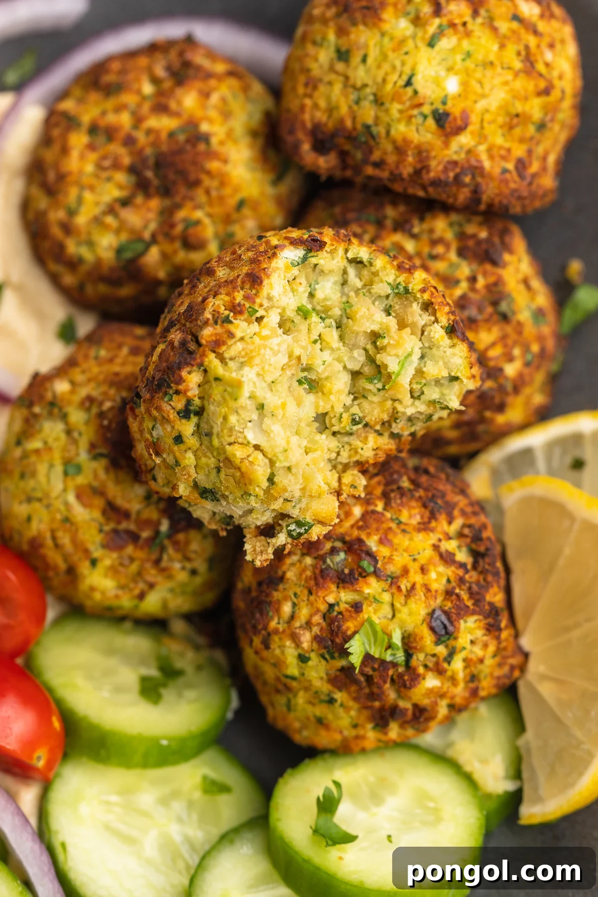 Golden Crispy Air Fryer Falafel 3 Close-up of air fryer falafel with a bite taken out.
