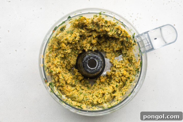 Golden Crispy Air Fryer Falafel 4 Falafel mixture in food processor bowl.