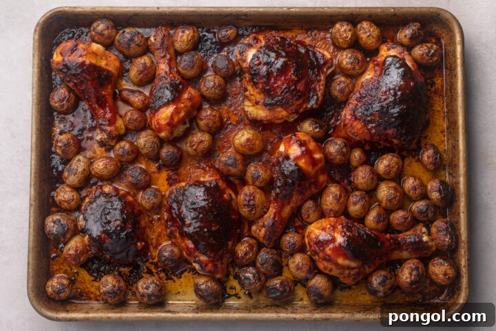 Sweet and Spicy Gochujang Sheet Pan Feast 9 Oven-roasted gochujang chicken thighs and potatoes on a sheet pan, cooked to perfection.